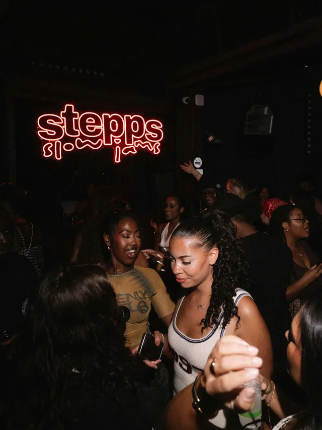 A candid moment among friends on the Stepps Slow Jams dance floor.