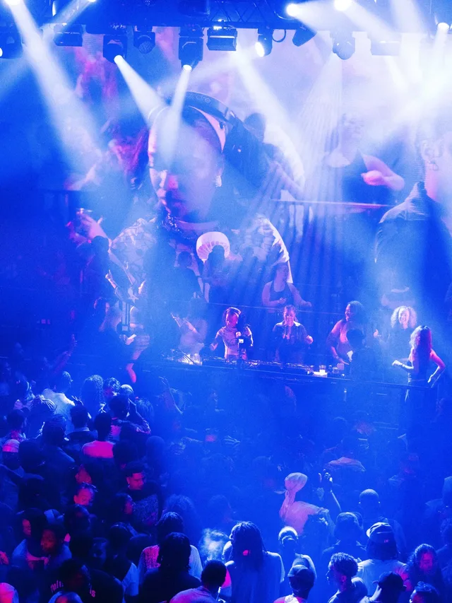 Blue light and haze over a packed Stepps dance floor.