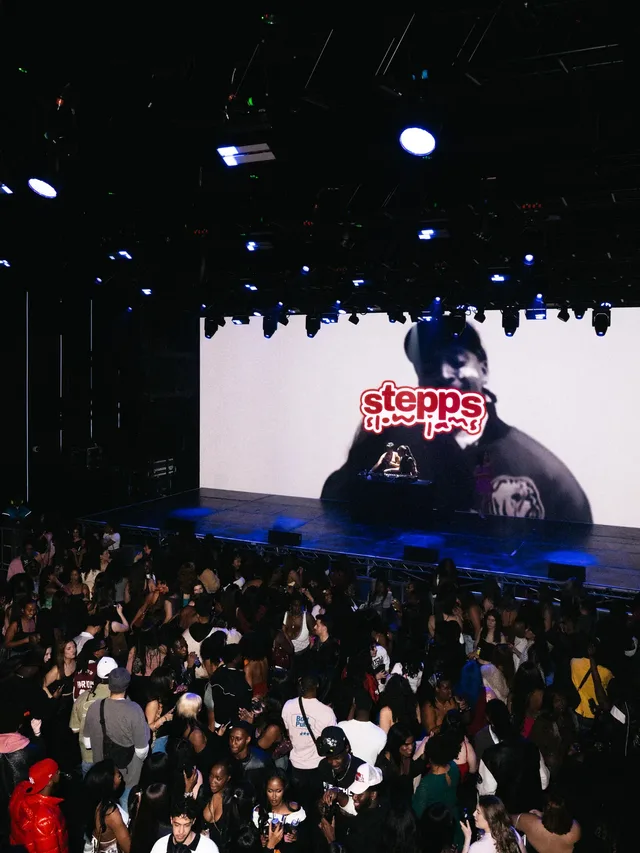 A packed dance floor beneath the Stepps Slow Jams screen.